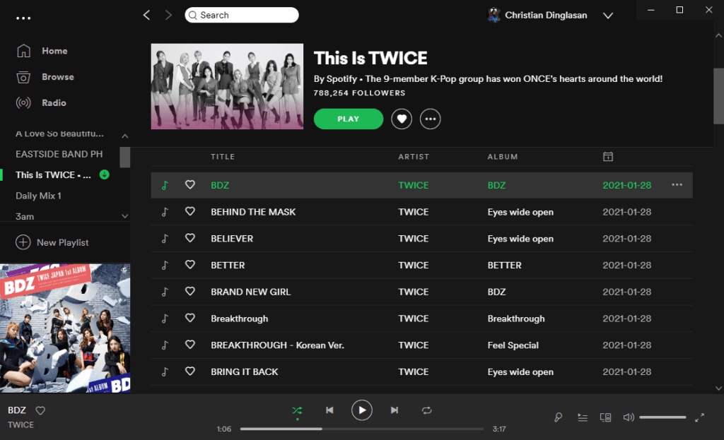 Green download icon next to the playlist / album name